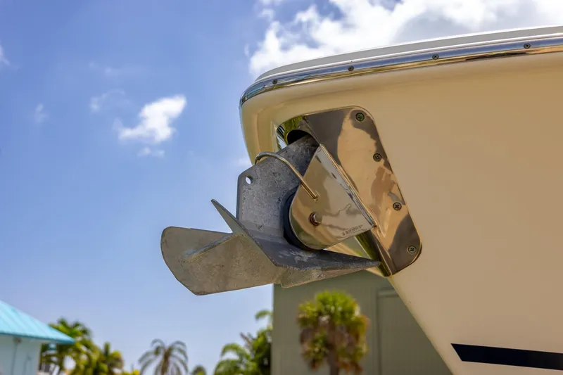 Slide: The Image of 2019 Boston Whaler 280 Outrage anchor detail against blue sky background. - 38