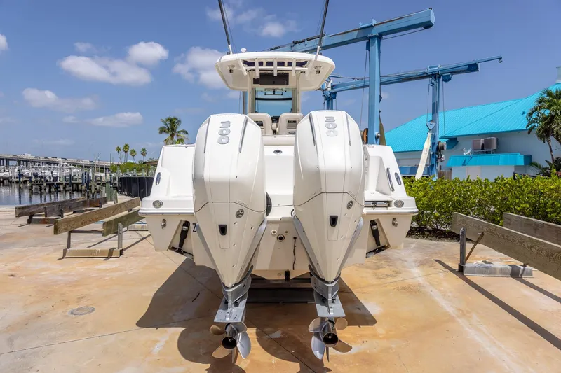 Slide: The Image of 2019 Boston Whaler 280 Outrage with dual engines at a marina. - 41