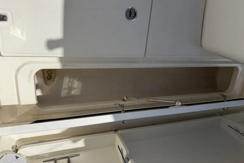 Slide: The Image of Storage compartment of a 2019 Boston Whaler 280 Outrage boat, open and empty. - 9