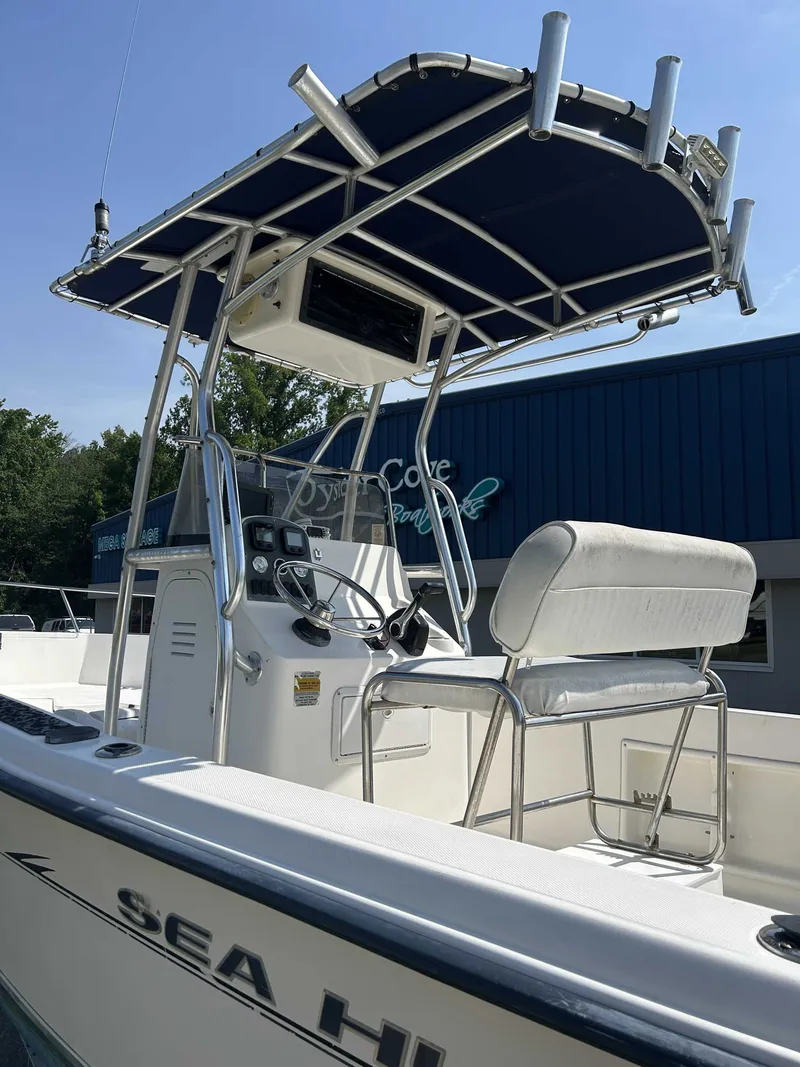 Slide: The Image of 2005 Sea Hunt Triton 202 boat with console and seating. - 3