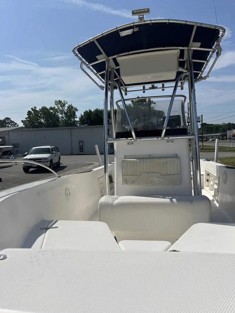 Slide: The Image of 2005 Sea Hunt Triton 202 boat with blue sunshade. - 4