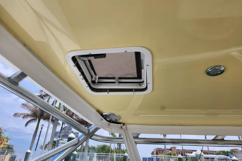 Slide: The Image of 1987 Young Brothers Custom Sport Fish boat interior with hatch and metal frame. - 10