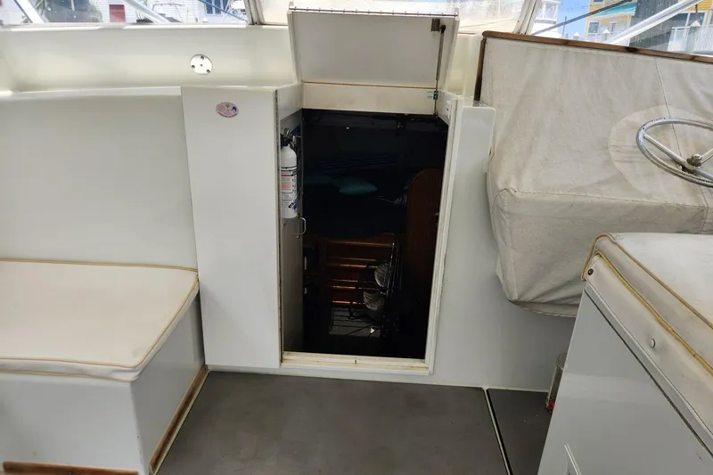 Slide: The Image of Interior view of 1987 Young Brothers Custom Sport Fish boat, showing cabin entrance and seating. - 14