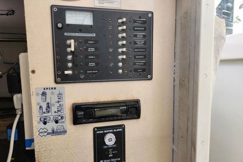 Slide: The Image of Electrical panel on a 1987 Young Brothers Custom Sport Fish boat with EPIRB instructions. - 20