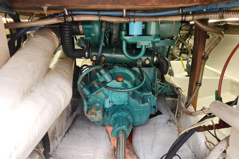 Slide: The Image of Engine room of 1987 Young Brothers Custom Sport Fish boat, showcasing mechanical components. - 22