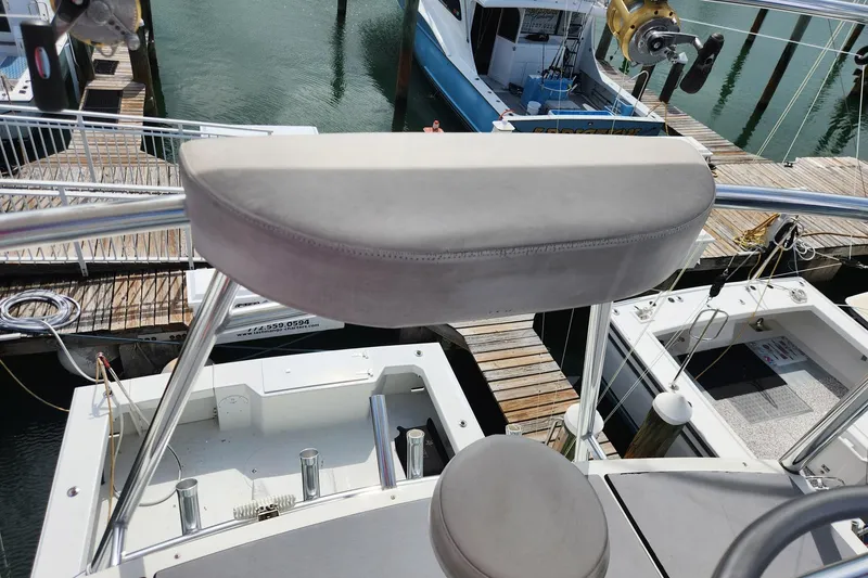 Slide: The Image of 1987 Young Brothers Custom Sport Fish boat docked at marina, view from helm seat. - 28