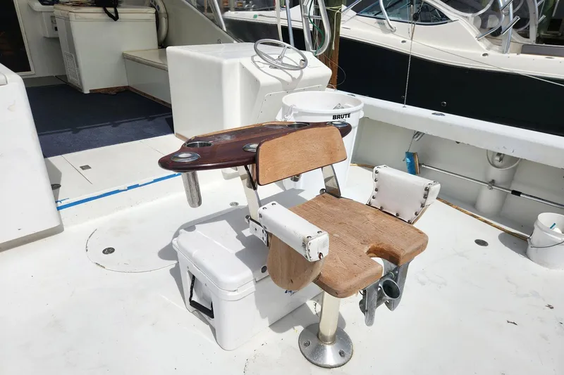 Slide: The Image of Fishing chair on 1987 Young Brothers Custom Sport Fish boat deck. - 31