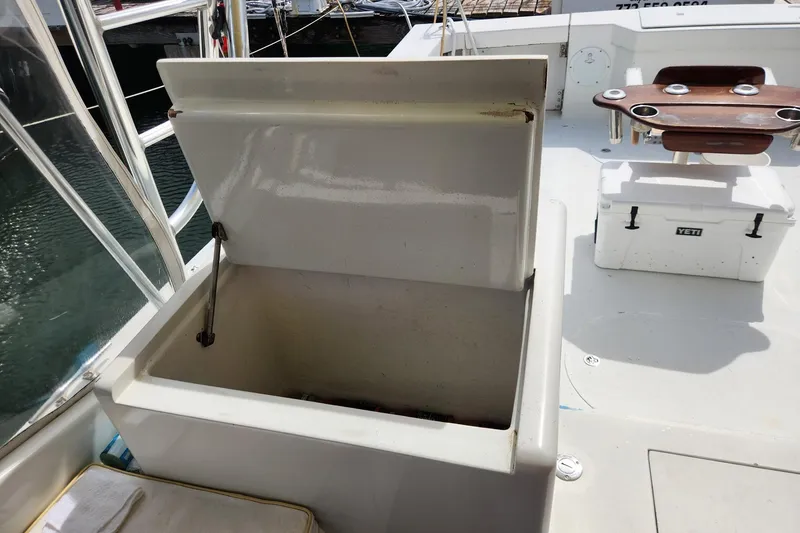 Slide: The Image of Open storage compartment on 1987 Young Brothers Custom Sport Fish boat deck. - 34