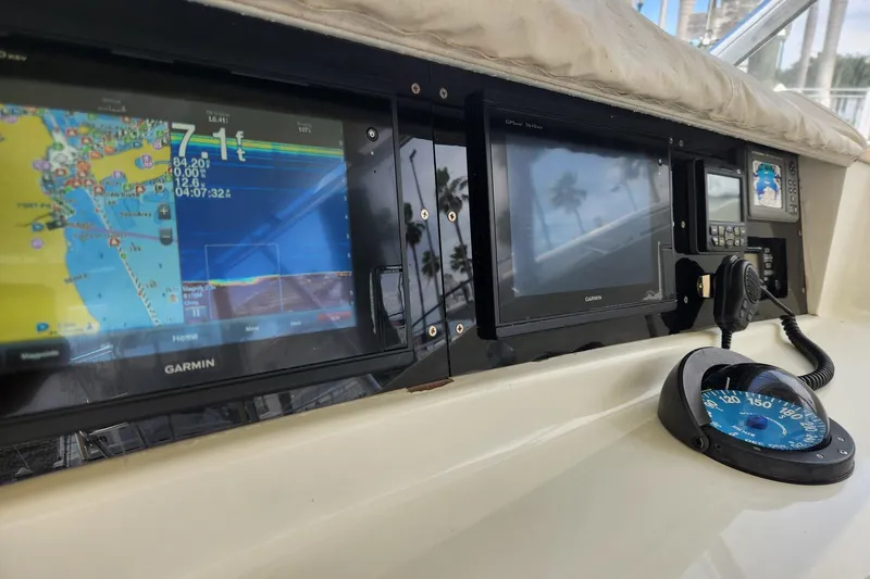 Slide: The Image of Control panel of a 1987 Young Brothers Custom Sport Fish boat with navigation equipment. - 8