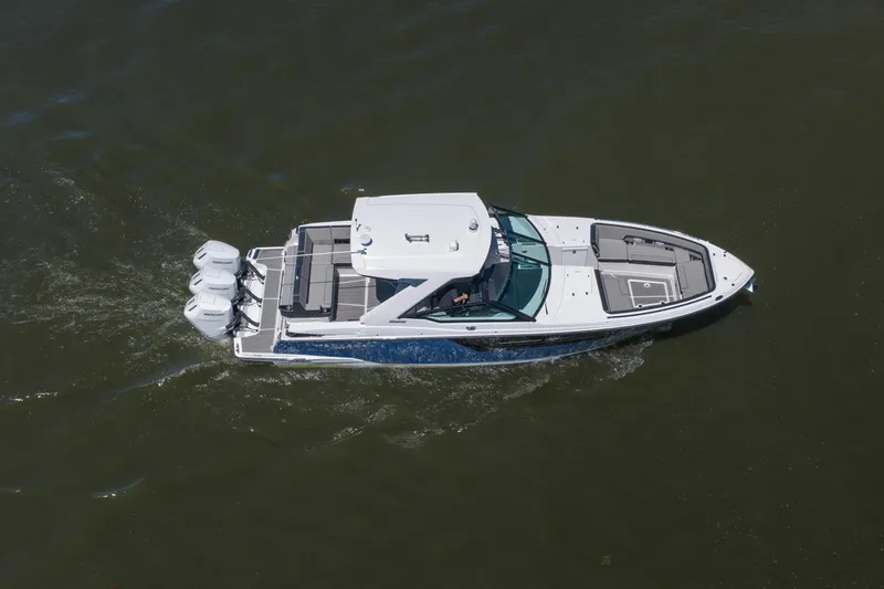 Slide: The Image of 2027 Monterey 385SS Super Sport boat cruising on water, aerial view. - 10
