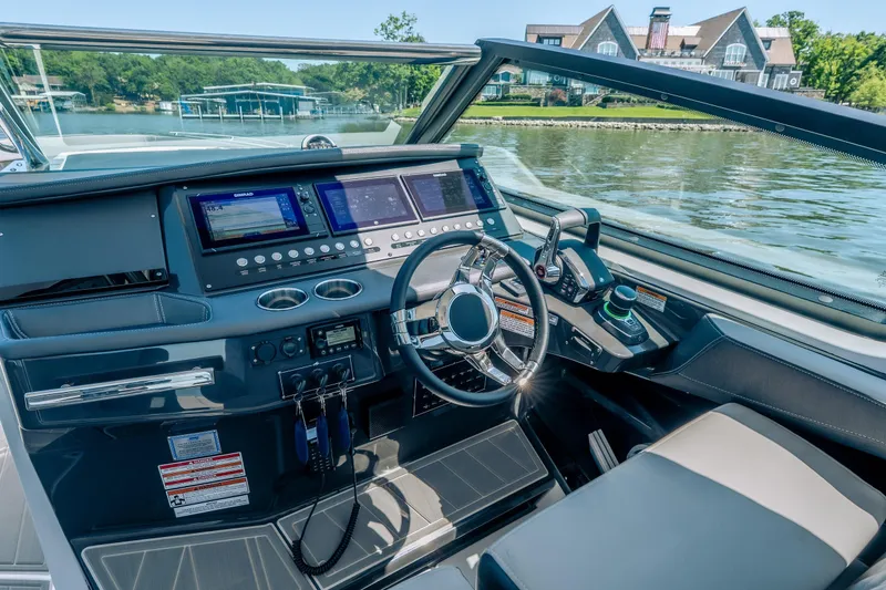 Slide: The Image of 2027 Monterey 385SS Super Sport boat cockpit with advanced navigation system and luxurious interior. - 22