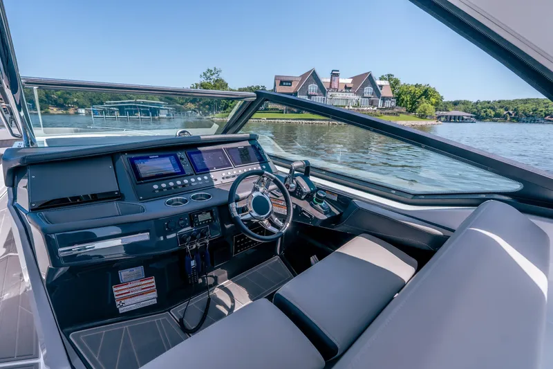Slide: The Image of Interior view of 2027 Monterey 385SS Super Sport boat with advanced dashboard controls. - 25