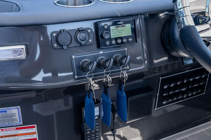 Slide: The Image of Dashboard of 2027 Monterey 385SS Super Sport boat with controls and keys. - 28