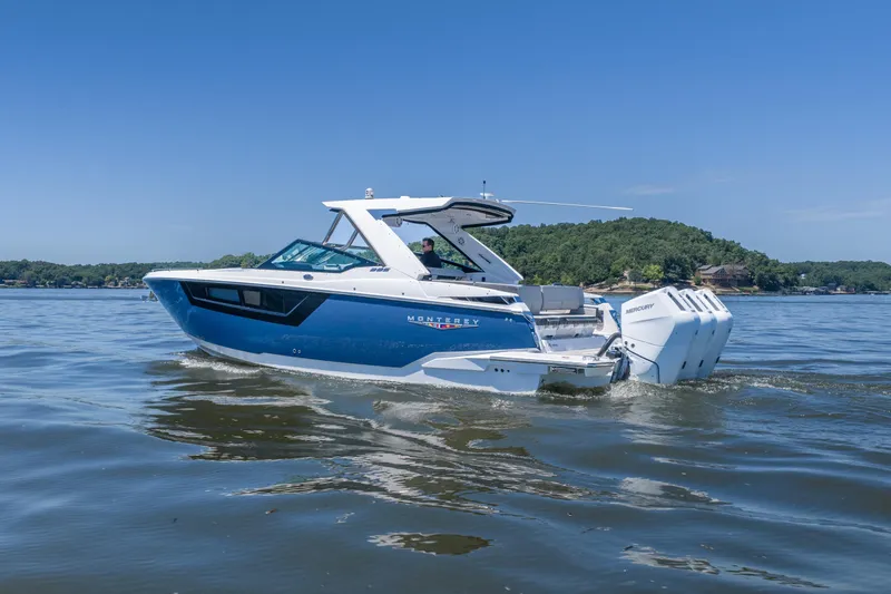 Slide: The Image of 2027 Monterey 385SS Super Sport boat cruising on a lake under clear blue skies. - 3