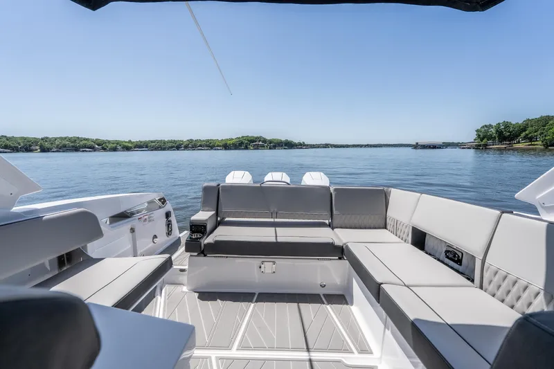Slide: The Image of Luxurious seating on 2027 Monterey 385SS Super Sport boat with scenic lake view. - 32
