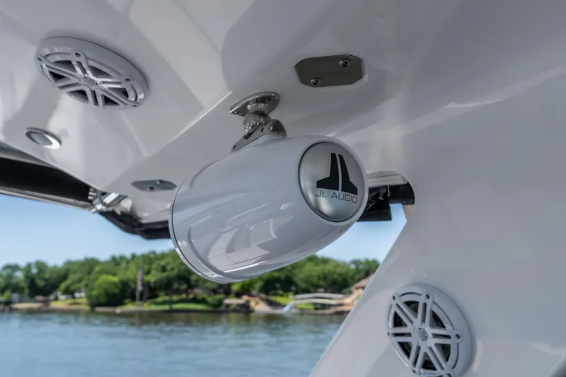 Slide: The Image of JL Audio speakers on 2027 Monterey 385SS Super Sport boat, with scenic water view. - 34