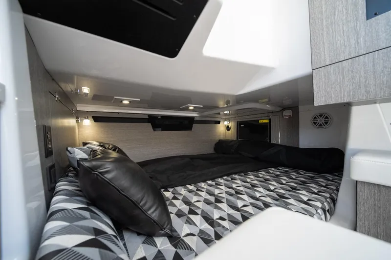 Slide: The Image of Luxurious cabin interior of 2027 Monterey 385SS Super Sport boat with modern bedding. - 37