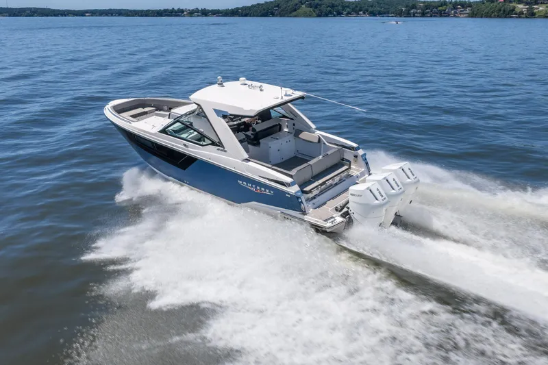 Slide: The Image of 2027 Monterey 385SS Super Sport boat cruising on a lake with powerful engines. - 4
