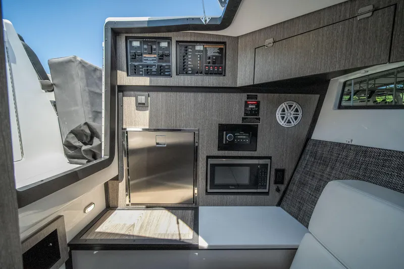 Slide: The Image of Interior of 2027 Monterey 385SS Super Sport boat with modern amenities and control panels. - 40