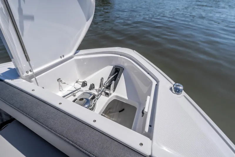 Slide: The Image of Open anchor compartment of 2027 Monterey 385SS Super Sport boat on calm water. - 45