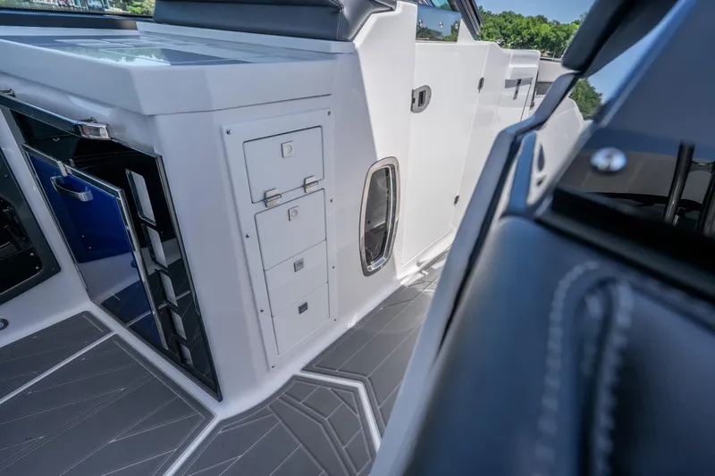 Slide: The Image of Interior view of 2027 Monterey 385SS Super Sport boat, featuring sleek cabinetry and modern design. - 49