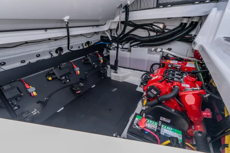 Slide: The Image of Engine compartment of 2027 Monterey 385SS Super Sport boat, showcasing red engine and wiring. - 55