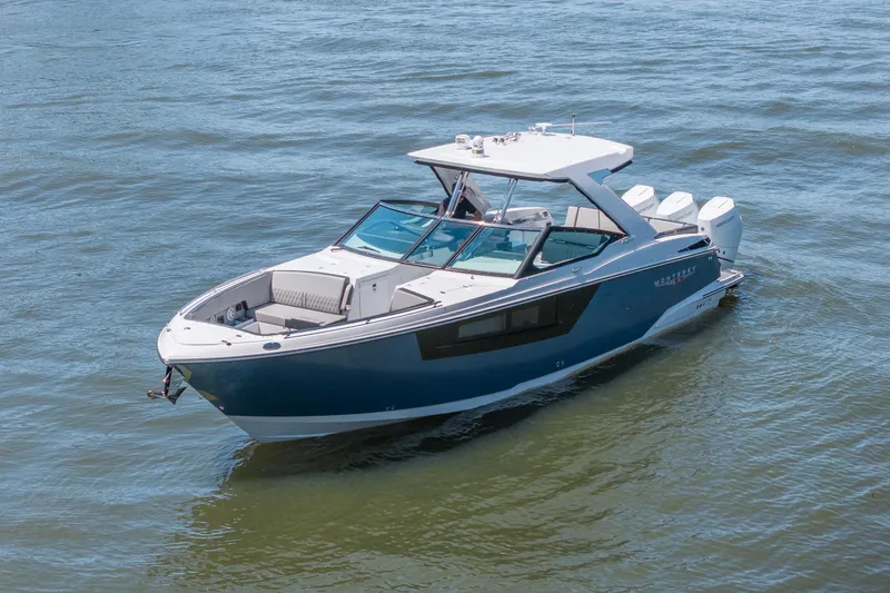 Slide: The Image of 2027 Monterey 385SS Super Sport boat on calm water, showcasing sleek design and luxury features. - 6