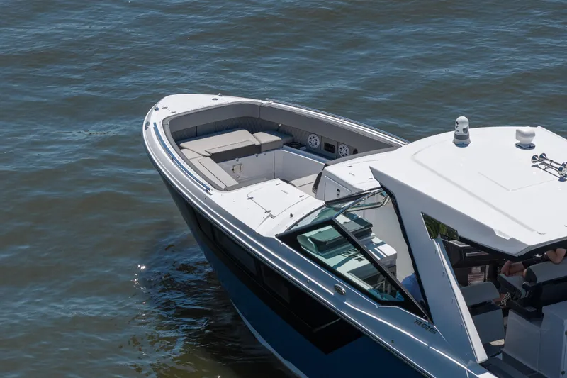 Slide: The Image of 2027 Monterey 385SS Super Sport boat cruising on calm waters. - 8