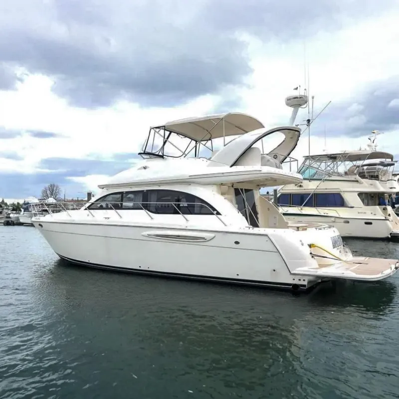 The Image of 2004 Meridian 411 Sedan yacht on water, cloudy sky. - 0