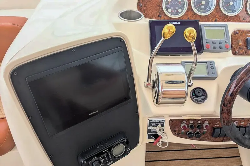 Slide: The Image of Control console of a 2004 Meridian 411 Sedan boat. - 16