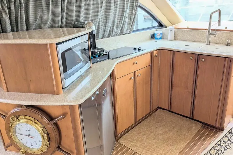 Slide: The Image of Interior of 2004 Meridian 411 Sedan yacht, kitchen with microwave and sink. - 22