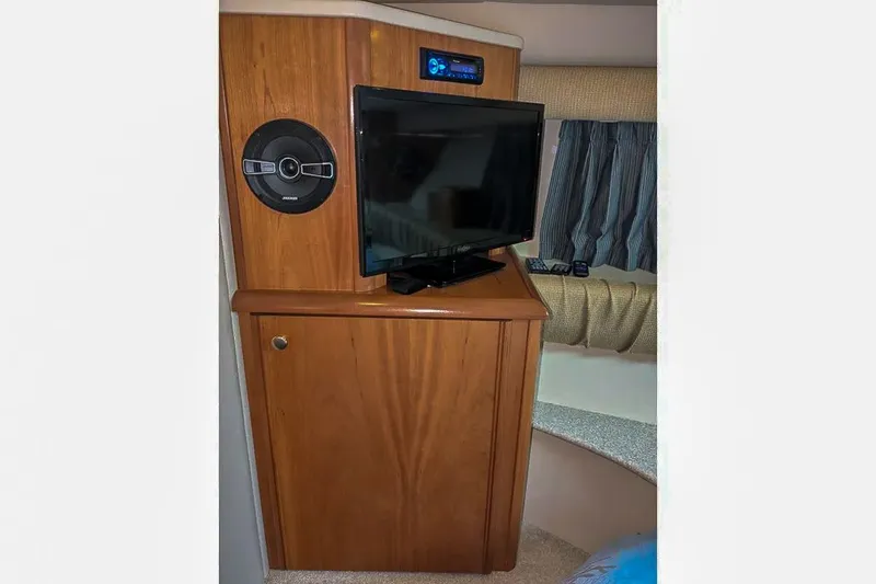 Slide: The Image of Interior of a 2004 Meridian 411 Sedan yacht with TV and speaker. - 26
