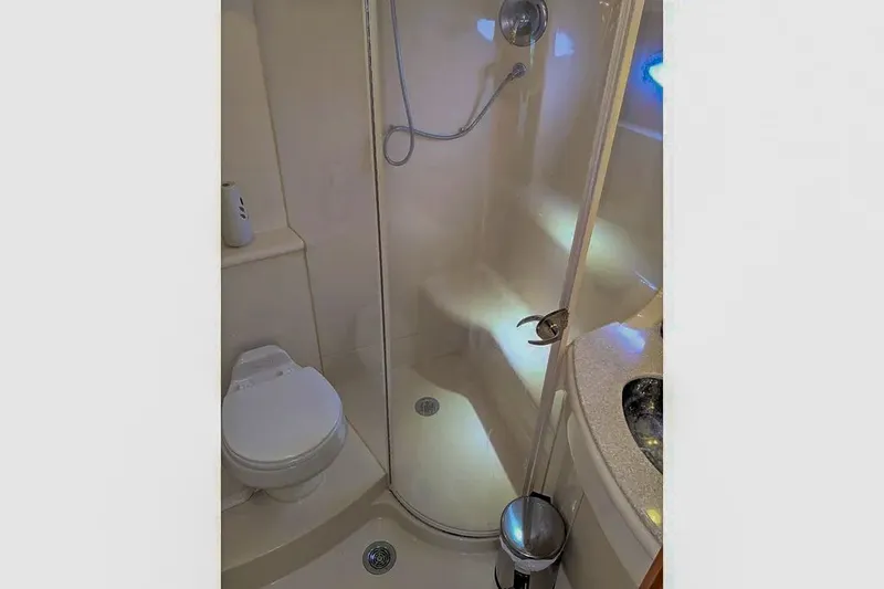 Slide: The Image of Bathroom in 2004 Meridian 411 Sedan with shower and toilet. - 28