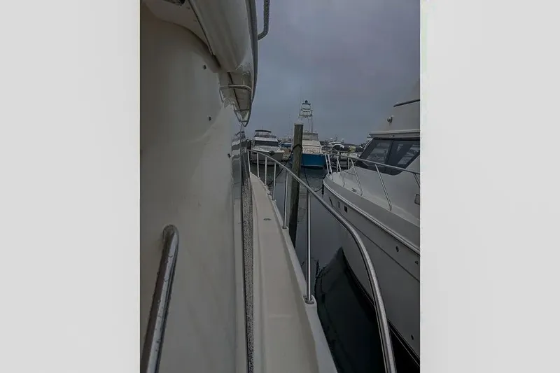Slide: The Image of 2004 Meridian 411 Sedan docked at a marina. - 9