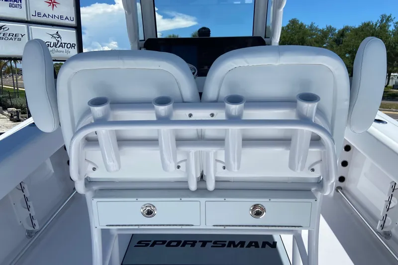 Slide: The Image of 2026 Sportsman Heritage 231 Center Console boat interior with rod holders and storage drawers. - 10
