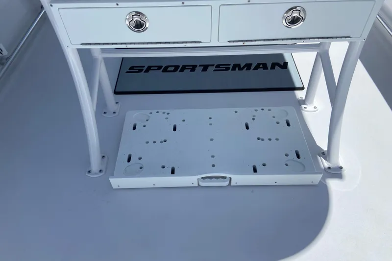 Slide: The Image of 2026 Sportsman Heritage 231 Center Console boat interior with storage compartments. - 12
