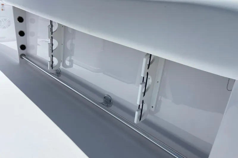 Slide: The Image of 2026 Sportsman Heritage 231 Center Console interior detail, featuring rod holders and sleek design. - 15