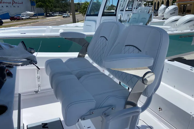 Slide: The Image of 2026 Sportsman Heritage 231 Center Console boat with luxurious seating and modern design. - 17