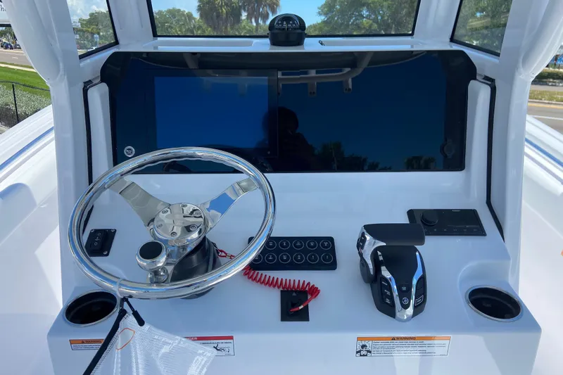 Slide: The Image of 2026 Sportsman Heritage 231 Center Console dashboard with steering wheel and controls. - 18