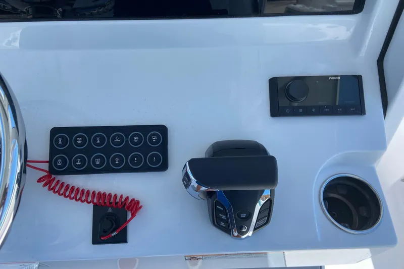 Slide: The Image of 2026 Sportsman Heritage 231 Center Console dashboard with controls and cup holder. - 19