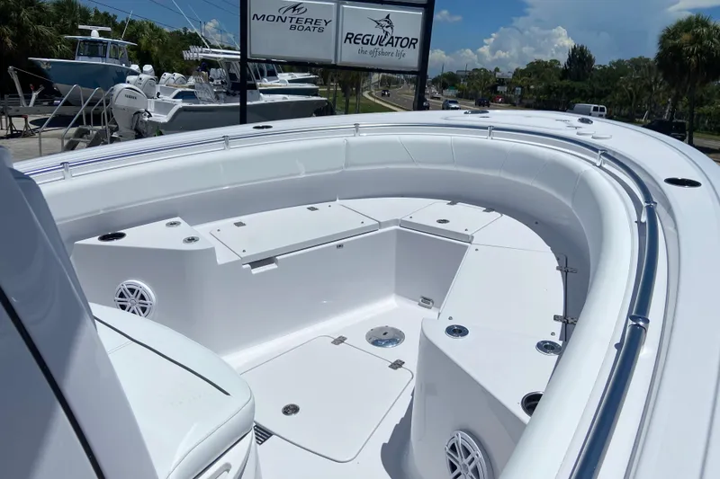 Slide: The Image of 2026 Sportsman Heritage 231 Center Console boat interior with seating and storage compartments. - 22