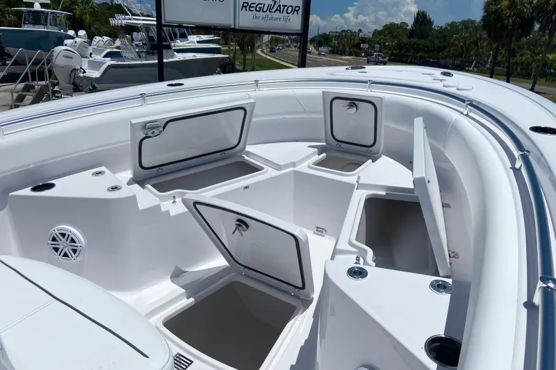 Slide: The Image of 2026 Sportsman Heritage 231 Center Console boat with open storage compartments. - 23
