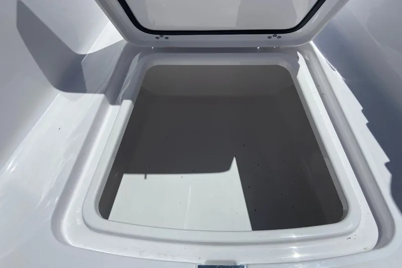Slide: The Image of Open storage compartment on 2026 Sportsman Heritage 231 Center Console boat. - 24