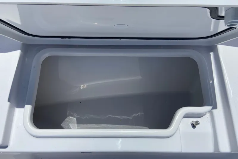 Slide: The Image of Open storage compartment on 2026 Sportsman Heritage 231 Center Console boat. - 25