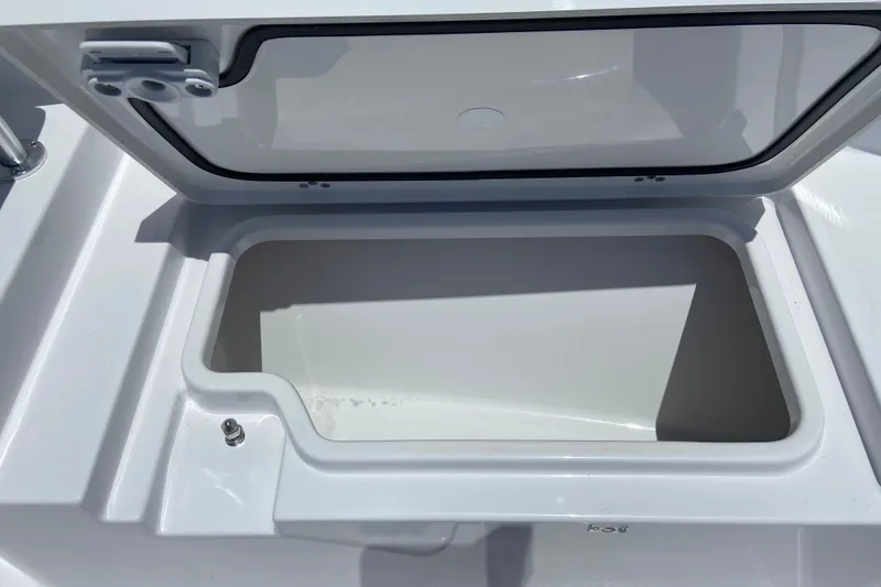 Slide: The Image of Open storage compartment on 2026 Sportsman Heritage 231 Center Console boat. - 26