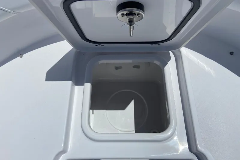 Slide: The Image of Open storage compartment on 2026 Sportsman Heritage 231 Center Console boat. - 27