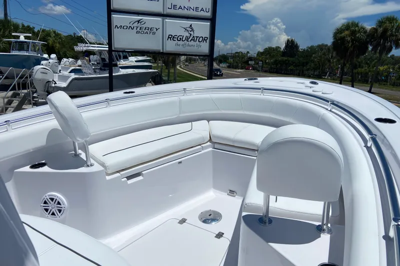 Slide: The Image of 2026 Sportsman Heritage 231 Center Console boat with white seating and sleek design. - 31