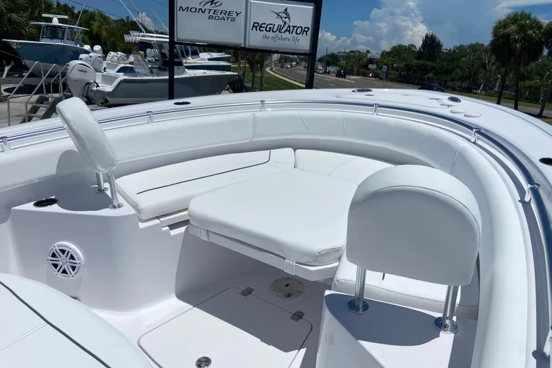 Slide: The Image of 2026 Sportsman Heritage 231 Center Console boat with white seating and sleek design. - 32