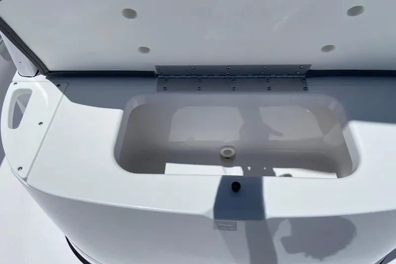 Slide: The Image of Open storage compartment on 2026 Sportsman Heritage 231 Center Console boat. - 35
