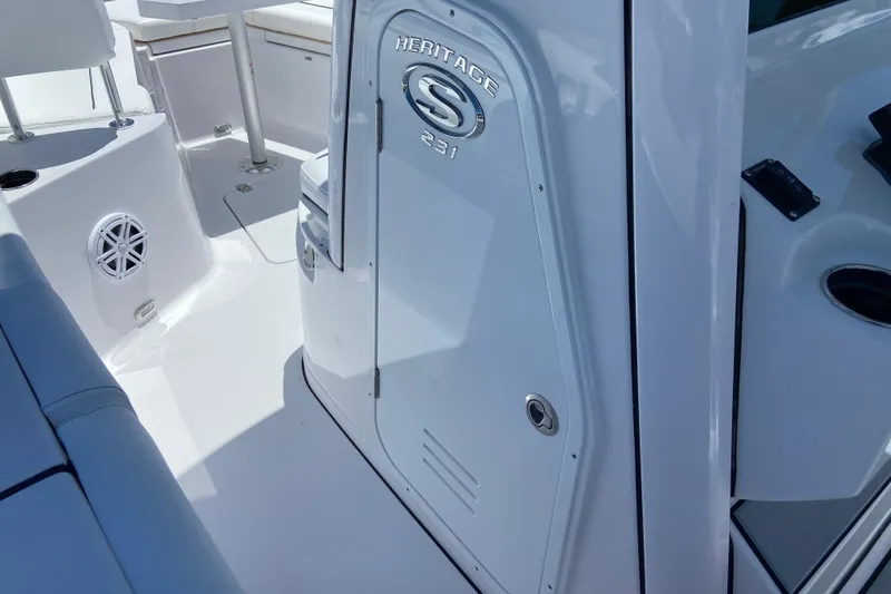 Slide: The Image of 2026 Sportsman Heritage 231 Center Console interior, featuring sleek white design and modern amenities. - 36